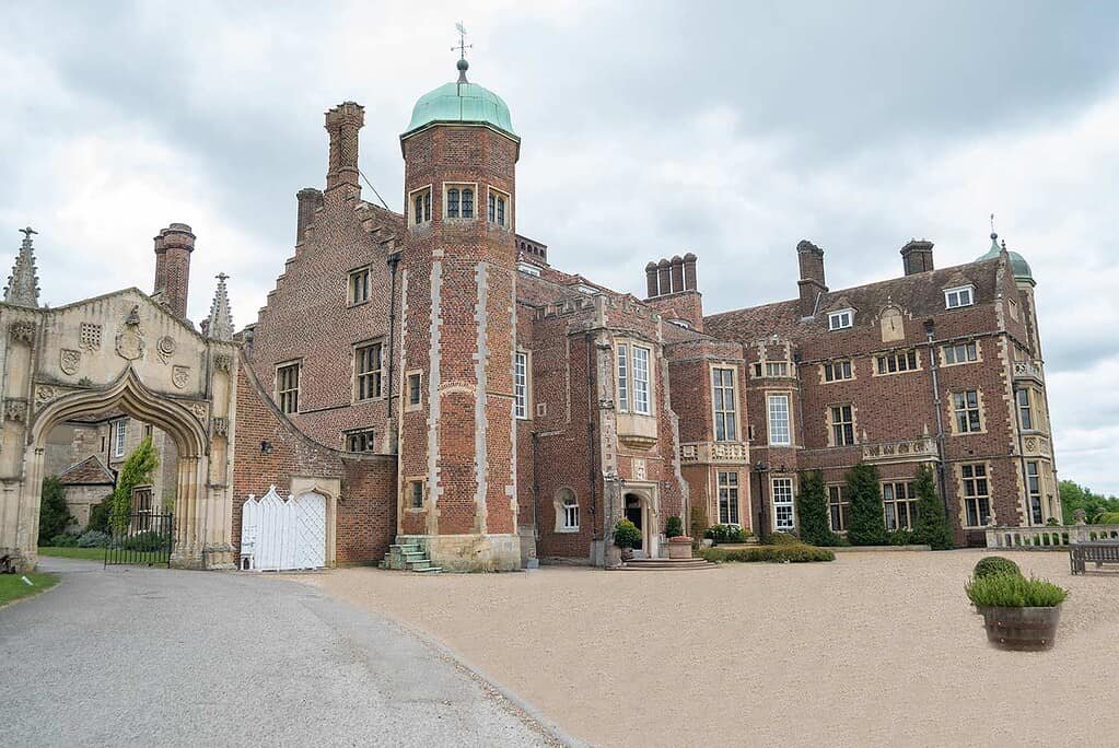 Opulent Cambridge Castle with historic brick architecture and lush gardens in Cambridge tours.