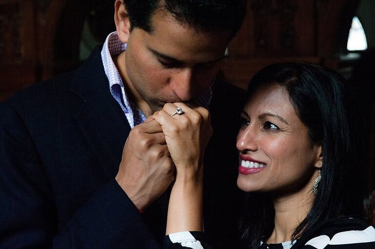 Intimate moment between a couple during a romantic tour in Cambridge, UK.