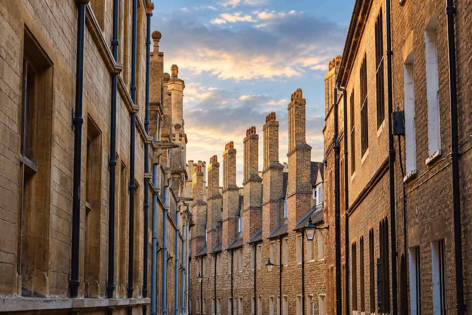 Warm evening light on the buildings and chimneys of Trinity Lane, Cambridge